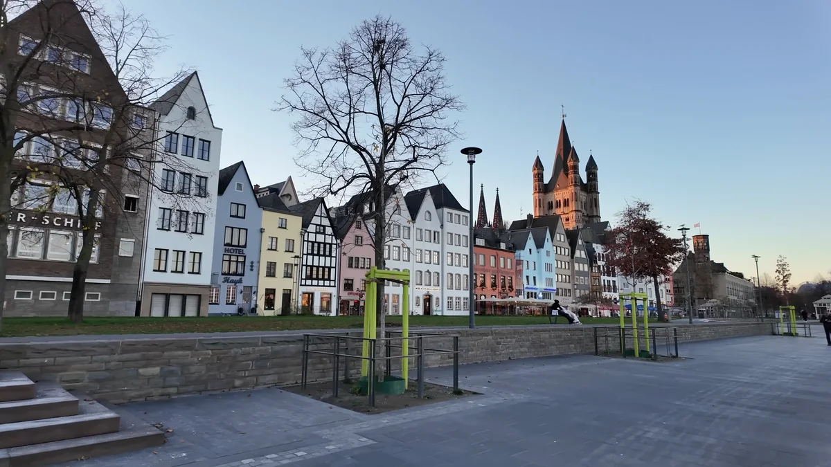 Colourful houses on the Rhine in Cologne Old Town (Altstadt) with Great St Martin Church