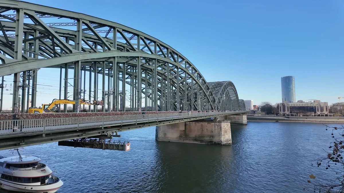 The steel arches of the Hohenzollern Bridge over the Rhine on a sunny day