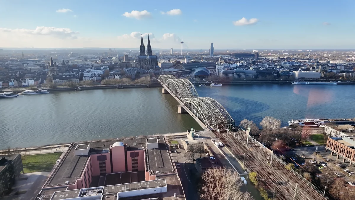 View of the Rhine, the Hohenzollern Bridge and Cologne Cathedral from the KölnTriangle viewing terrace