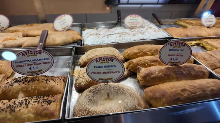 Trays of tiropita and spanakopita pies in the Ariston display, Athens