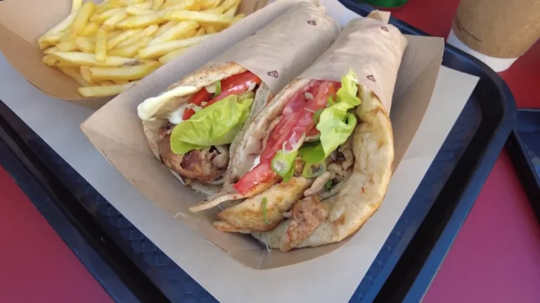 Chicken gyros pita and fries on a tray at Hoocut, Monastiraki, Athens