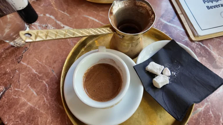 Foamy Greek coffee from a copper pot at Mokka, Athens