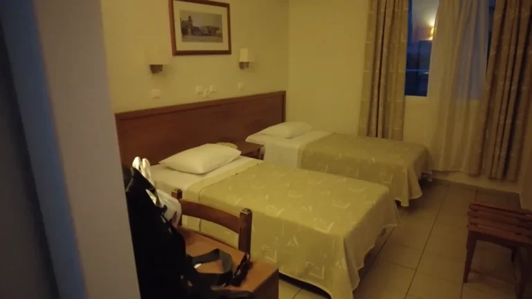 A simple twin-bed hotel room with balcony where we stayed near Omonia in Athens