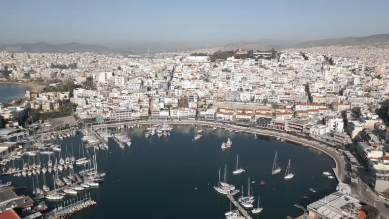 The round bay of Mikrolimano and Piraeus houses from the air