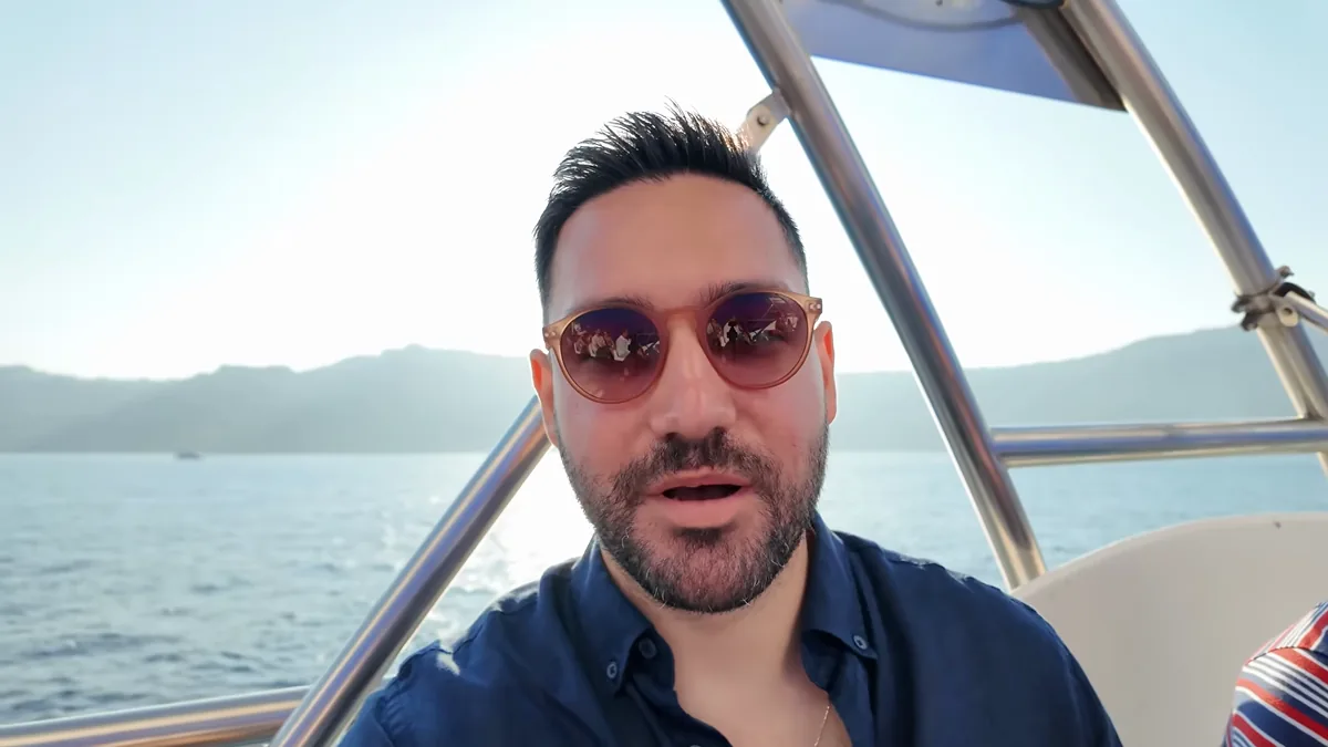 Going ashore by tender in Santorini, the caldera behind