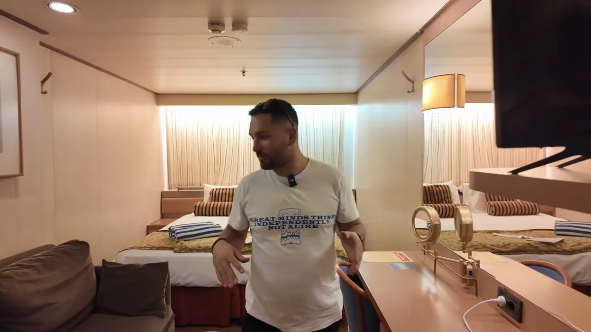 Celestyal Journey inside cabin with double bed and desk