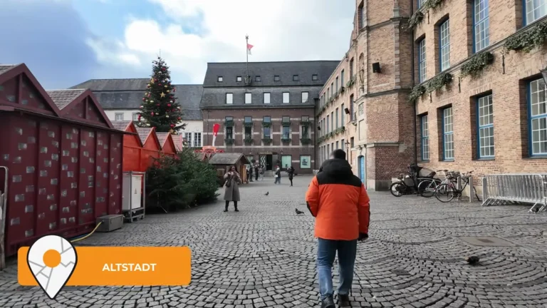 Marktplatz in Düsseldorf Old Town with the town hall and Christmas stalls by day