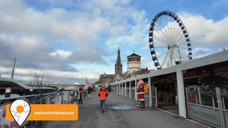 The Wheel of Vision Ferris wheel and Christmas stalls on the Rhine promenade in Düsseldorf