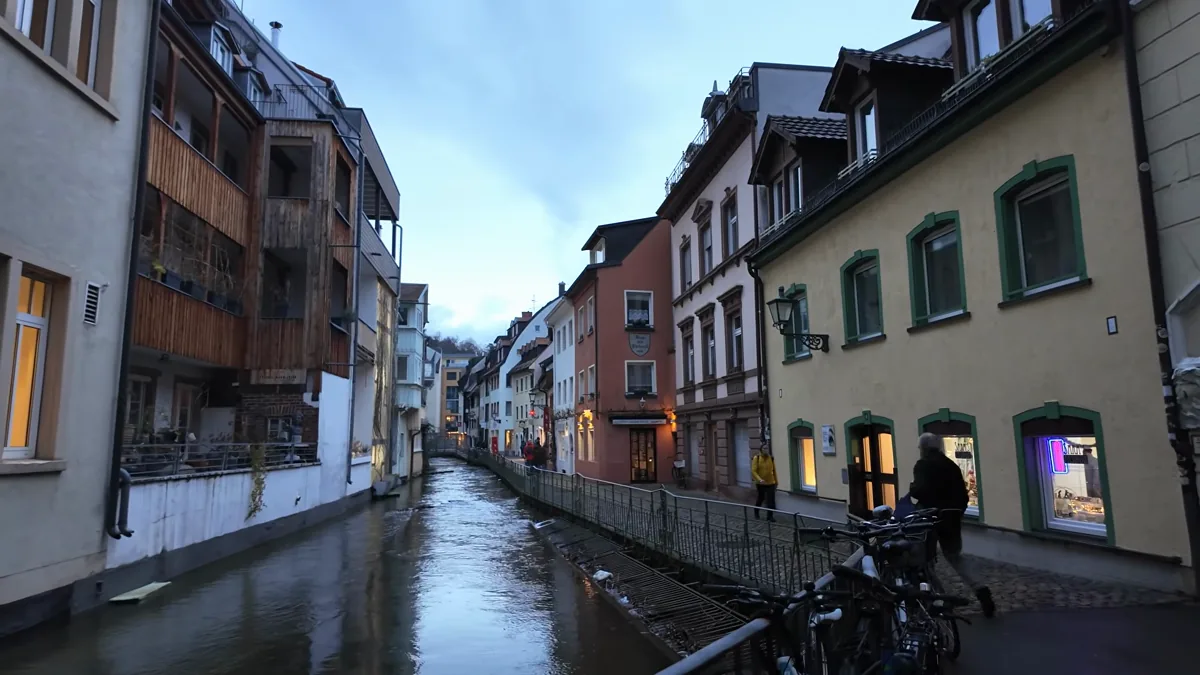 Water canal running between old houses in Freiburg