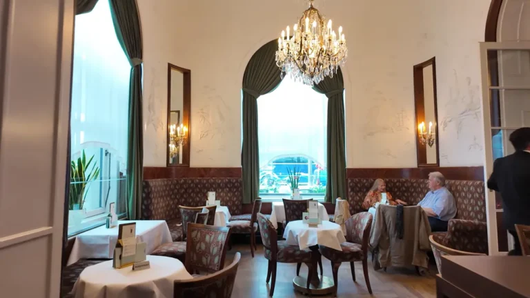 Inner salon lit by chandeliers at Café Landtmann