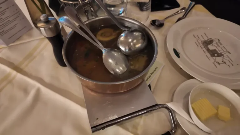 Beef broth ladled from the copper pot at Plachutta