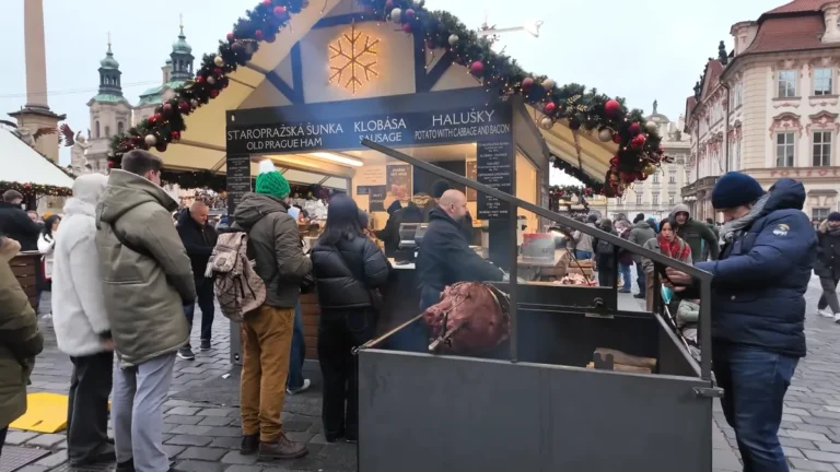 Staropražská šunka, Old Prague ham turning on a spit over a wood fire at the Old Town Square Christmas market, Prague