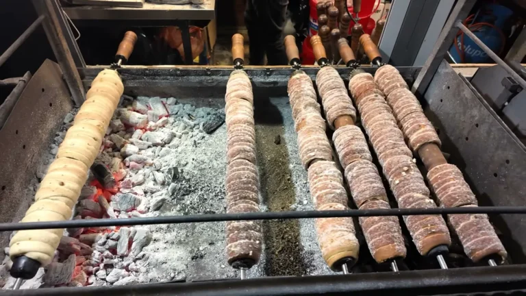 Trdelník turning over the coals at the Prague Old Town Square Christmas market