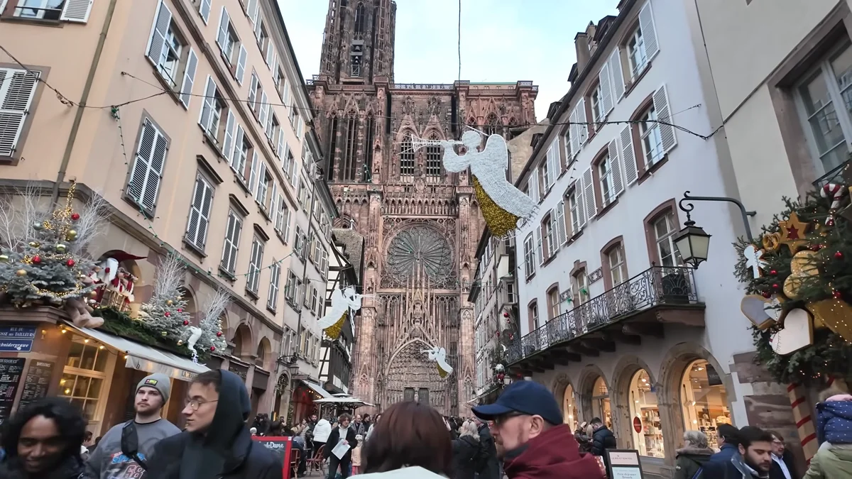 Strasbourg Cathedral’s pink sandstone facade seen from Rue Mercière in December